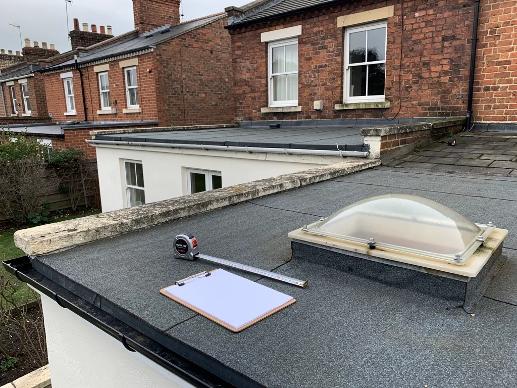 Measuring a flat roof for a new rooflight